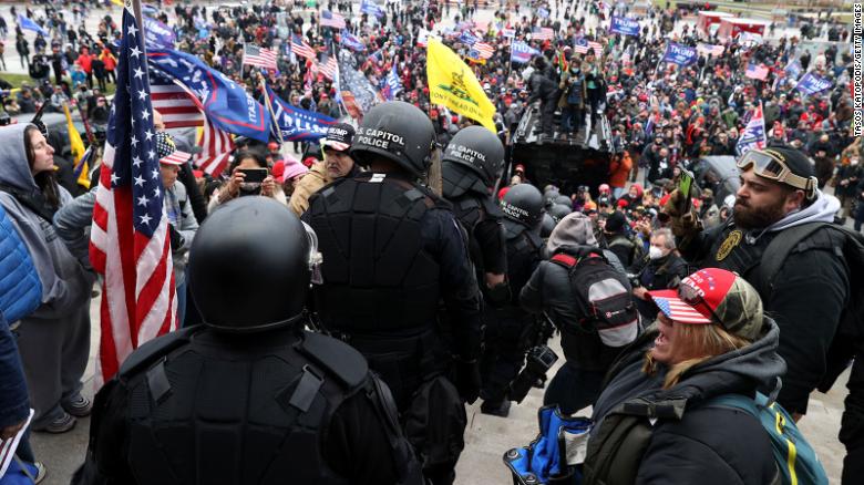 Roberto Minuta, on right with goggles,  joins demonstrators on the steps of the eastern side of the US Capitol.