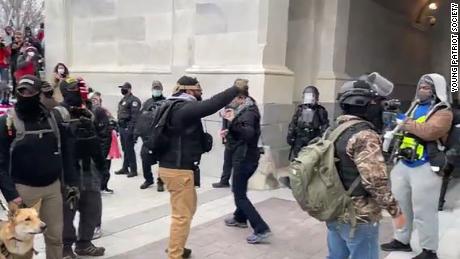 Roberto Minuta protests outside the US Capitol on January 6th.