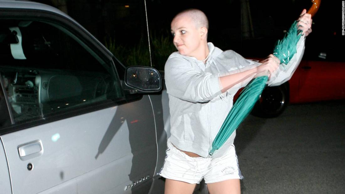 Spears attacks a paparazzo&#39;s car with an umbrella outside Federline&#39;s home in Tarzana, California, in 2007.