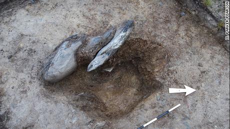 This stone hole was uncovered at Waun Mawn, with the stone packing used to secure the missing monolith still present.