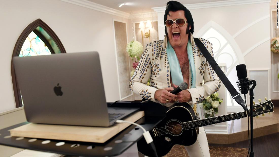 Elvis Presley impersonator and chapel co-owner Brendan Paul performs a vow renewal ceremony in Las Vegas using video-conferencing software on July 28.