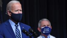 US President Joe Biden speaks, flanked by White House Chief Medical Adviser on Covid-19 Dr. Anthony Fauci (R) during a visit to the National Institutes of Health (NIH) in Bethesda, Maryland, February 11, 2021. (Photo by SAUL LOEB / AFP) (Photo by SAUL LOEB/AFP via Getty Images)