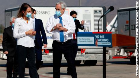 SANTIAGO, CHILE - JANUARY 28: : President of Chile Sebastian Piñera walks next to a vaccine container during the arrival of around 1.92 million of CoronaVac vaccine doses of the SINOVAC laboratory from Beijing, China, at Arturo Merino Benitez International Airport on January 28, 2021 in Santiago, Chile. Chilean Institute of Public Health approved the emergency use of the Chinese Sinovac vaccine for adults between 18 and 59 years old. (Photo by Marcelo Hernandez/Getty Images)