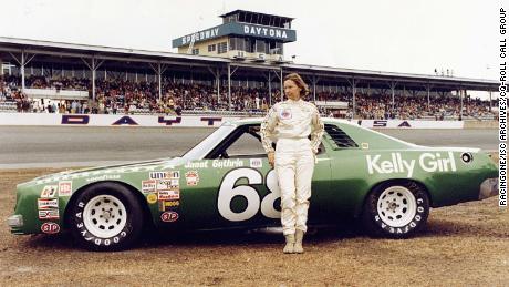 Driver Janet Guthrie stands in front of her No. 68 Chevrolet Chevelle Laguna before the 1977 Daytona 500. She was the first female driver to compete in the race. 