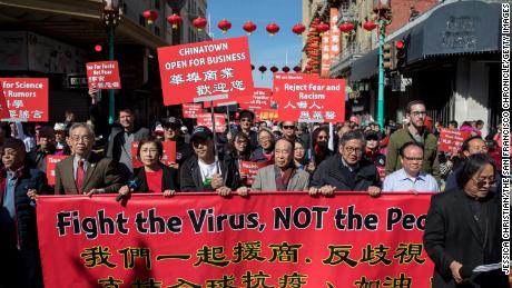 Hundreds of Chinatown residents in San Francisco take to the streets to protest against racism, on February 29, 2020.