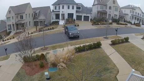 Truck slides down slick hill after winter storm