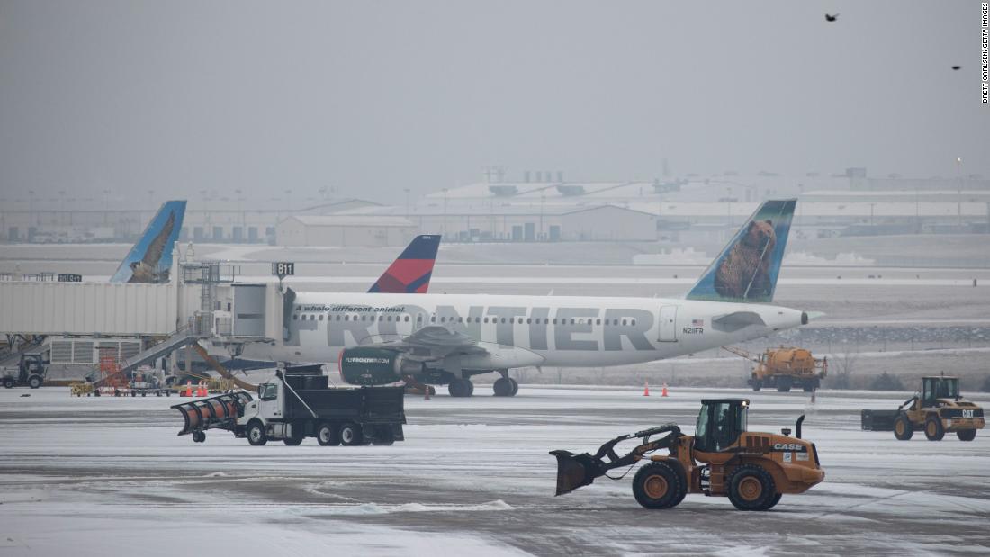 Vehicles clear ice at the international airport in Nashville, Tennessee, on Monday.