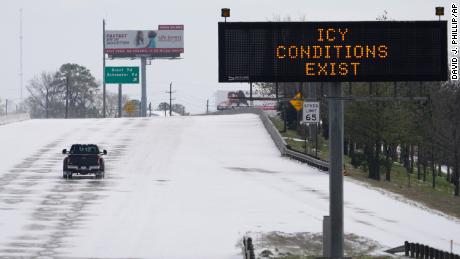 A truck braves the frozen roads in Houston on Monday, February 15.