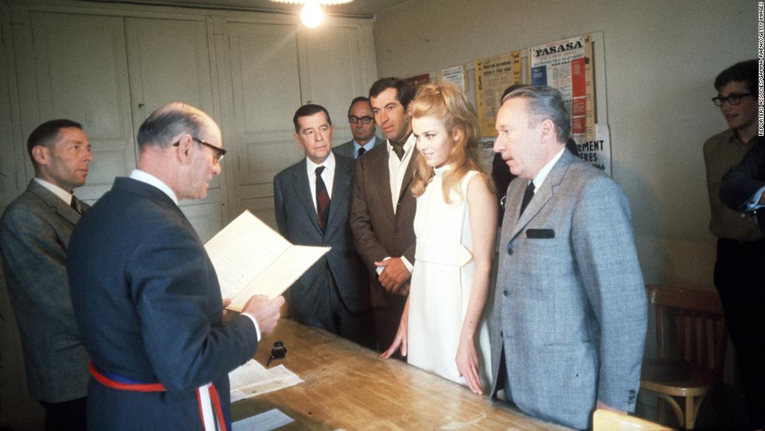 Fonda married French film director Roger Vadim, seen here in the brown suit, in 1965.