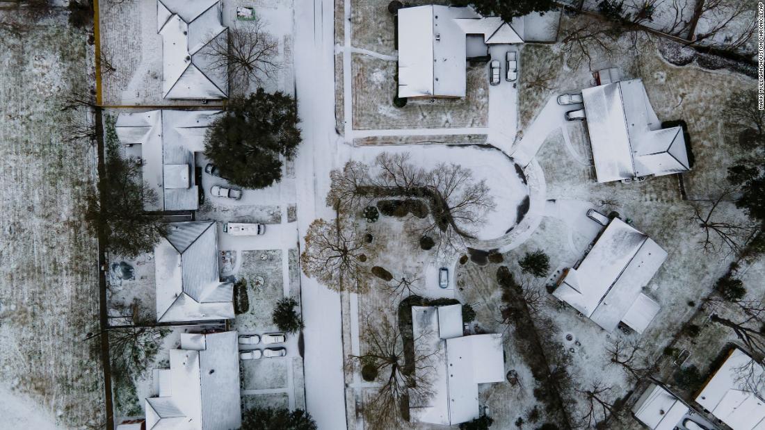 Homes in the Westbury neighborhood of Houston are covered in snow on Monday, February 15.