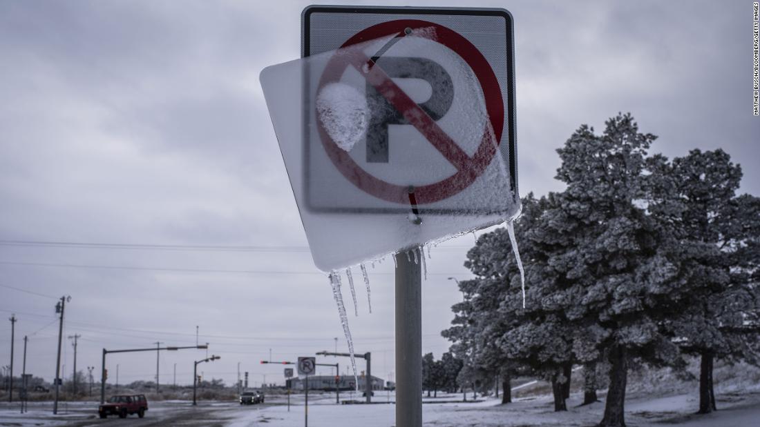 Ice coats a road sign in Midland, Texas, on Monday.