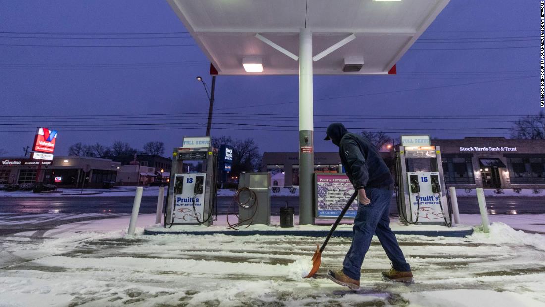 Kirk Caudill shovels snow in Louisville, Kentucky.