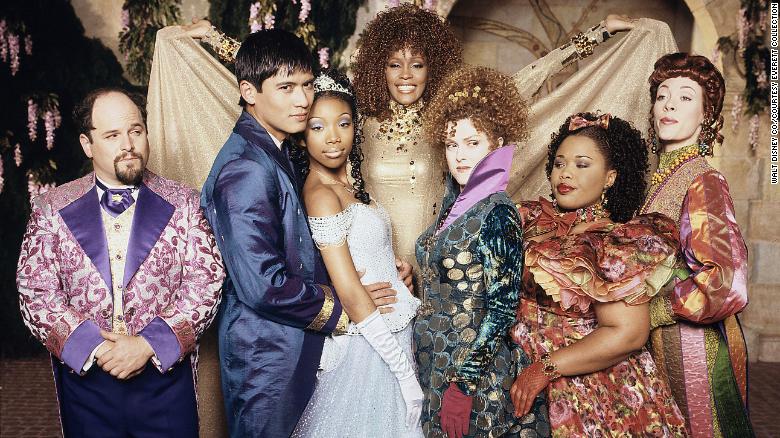 (From left) Jason Alexander, Paolo Montalban, Brandy, the late Whitney Houston, Bernadette Peters, the late Natalie Deselle Reid and Veanne Cox led the cast in &quot;Rodgers &amp; Hammerstein&#39;s Cinderella.&quot;