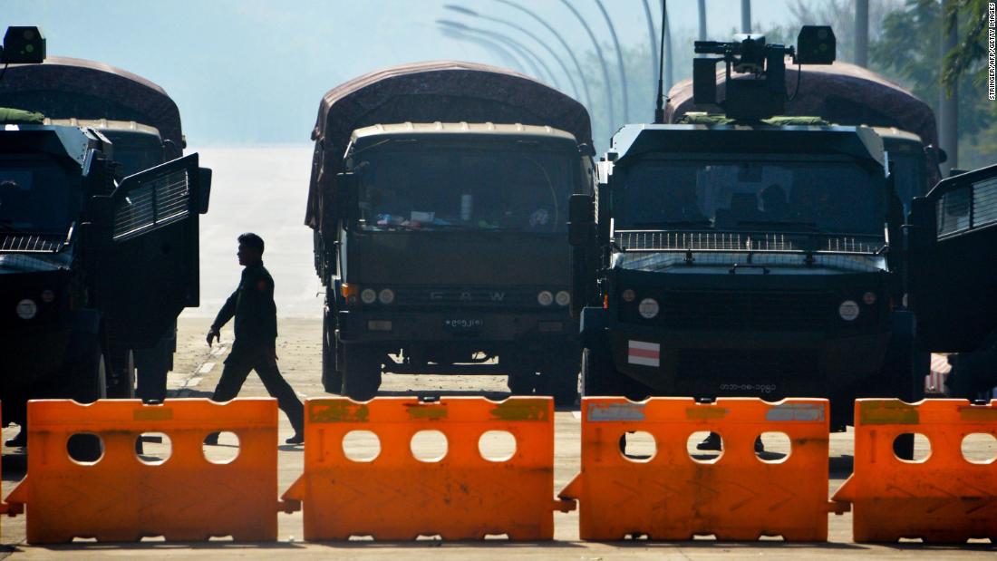 Soldiers block a road near Myanmar&#39;s Parliament on February 2, a day after the coup.