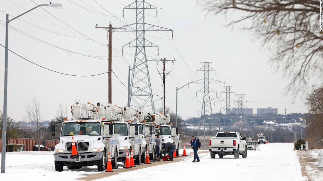 Electric service trucks line up in Fort Worth, Texas, on Tuesday.