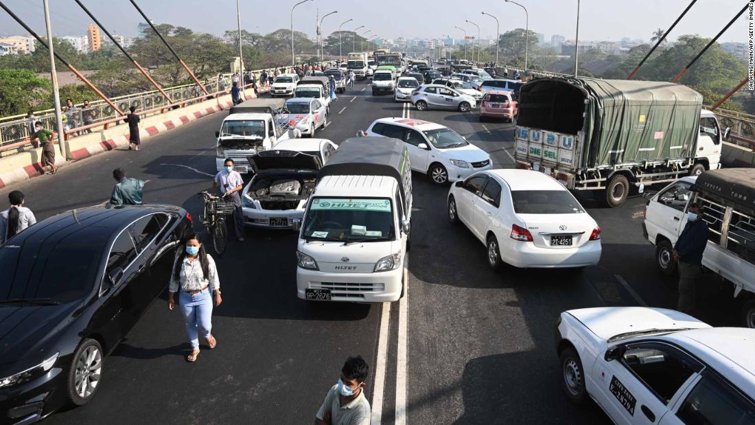 Demonstrators block a Yangon bridge with their cars on February 17.