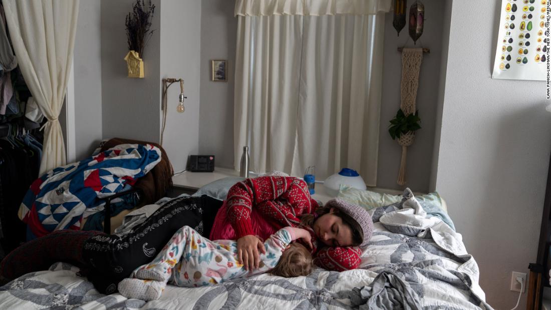 Maria Patterson breastfeeds her infant daughter Tuesday at their home in Austin, which hadn&#39;t had power since Sunday night.