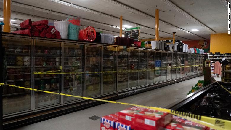 Freezer sections are closed off in Fiesta supermarket on Tuesday in Houston. 