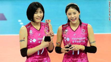 South Korean women volleyball twin stars Lee Jae-yeong, left, and Lee Da-yeong, right, of the Heungkuk Life Insurance Pink Spiders posing after they selected as all-stars before a V-League game at a gymnasium in Incheon. This picture was taken on January 26, 2021.