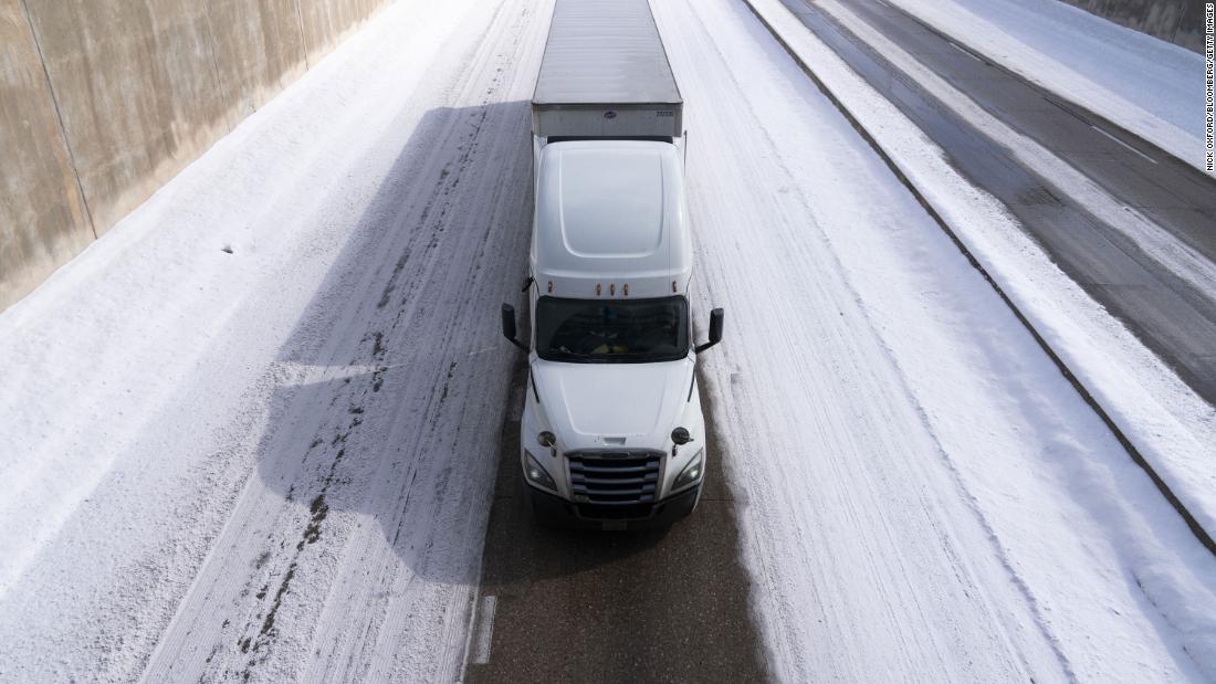 A truck travels along a snow-covered Interstate 44 in Oklahoma City on Wednesday.