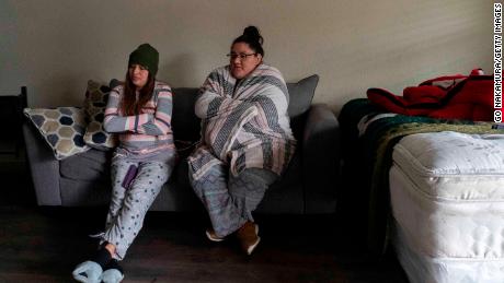 Karla Perez and Esperanza Gonzalez stay in their apartment during a power outage caused by the winter storm on February 16, 2021, in Houston, Texas. 