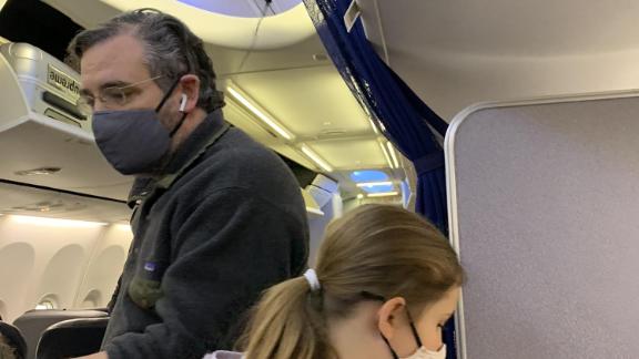 Sen. Ted Cruz is seen boarding a flight Wednesday at Houston IAH airport bound for Cancun, Mexico.