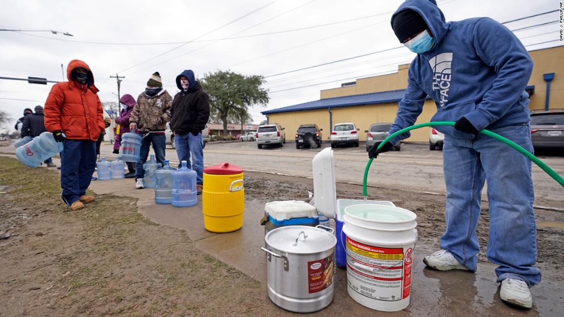 Jose Blanco fills a cooler with water from a public park spigot in Houston on Thursday. Houston and several surrounding cities were under a boil-water notice.