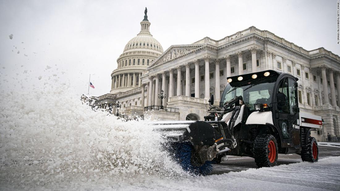 Snow is plowed outside the US Capitol on Thursday.
