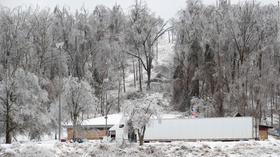 Downed and broken trees are seen over a rest stop in Huntington, West Virginia, on Wednesday.