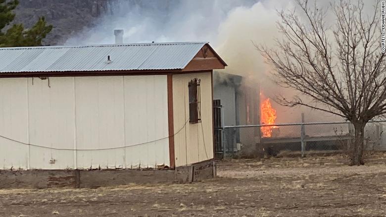 Stephanie Rubio could see smoke from the shop nearby when she and her son Levi went to buy more firewood to keep warm.