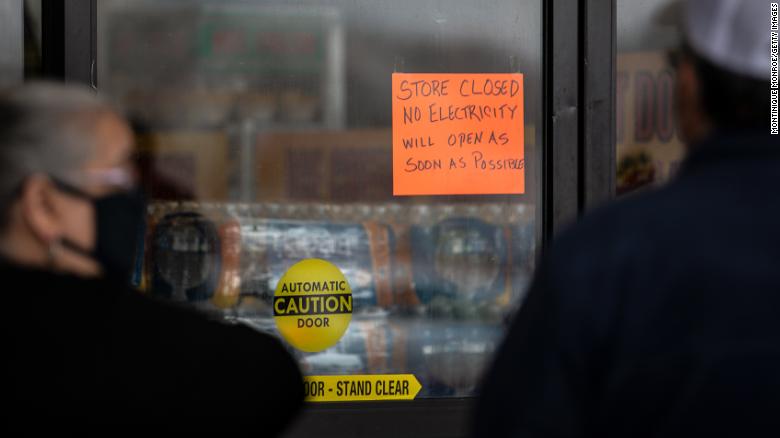 People wait in line for Fiesta Mart to open after the store lost electricity in Austin, Texas on February 17.