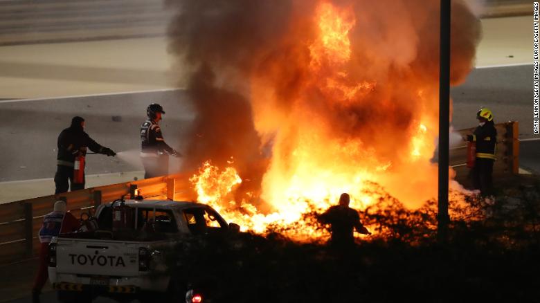 Grosjean&#39;s car caught fire after colliding with the barrier on the first lap of the Bahrain Grand Prix. 