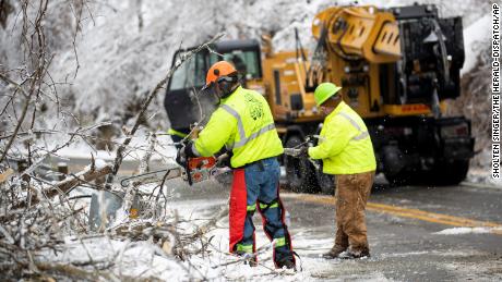 Workers clear snow in Huntington, West Virginia. 