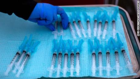 A nurse takes a Moderna Covid-19 vaccines ready to be administered at a vaccination site at Kedren Community Health Center, in South Central Los Angeles, California on February 16, 2021. 