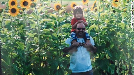Scott and Ailyn in a field of sunflowers in 2010.