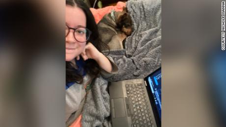 Fort Worth Star-Telegram reporter Nichole Manna (with her dog Ollie) tries to stay warm working from home. She turned her heat down to 65 to answer Texas&#39; call to conserve electricity. Her home is old and quite drafty.