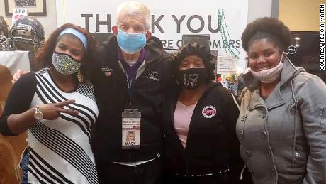 Furniture owner Jim &quot;Mattress Mack&quot; McIngvale with (from left) Felicia Maten, her mother Dora Maten Bell and her daughter Ebony Augustine.