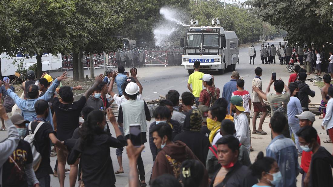 A police truck uses a water cannon to disperse protesters in Mandalay on February 20.