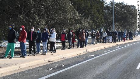 People wait for the Sam's Club store to open as they look to purchase essentials on Saturday, February 20, in Austin.