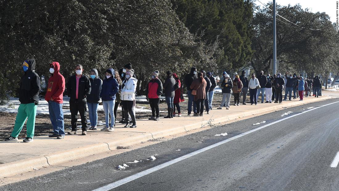 People wait for the Sam&#39;s Club store to open as they look to purchase essentials on Saturday, February 20, in Austin.