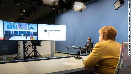 German Chancellor Angela Merkel during Friday&#39;s virtual Munich Security Conference with Biden and French President Emmanuel Macron on screen.