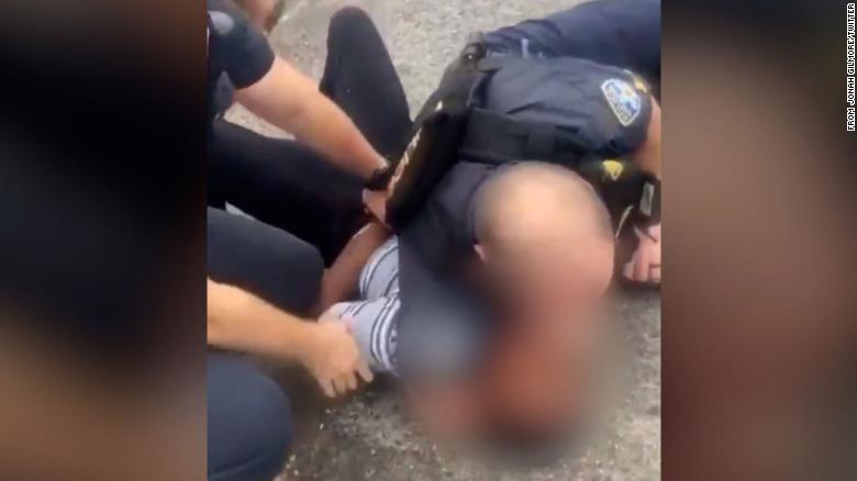 Baton Rouge police are investigating after a video shows an officer with his arm around teen’s neck during arrest