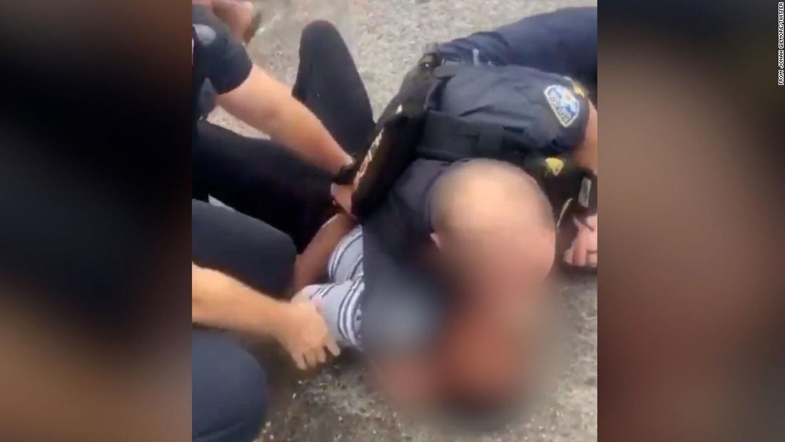 Baton Rouge police are investigating after a video shows an officer with his arm around teen's neck during arrest