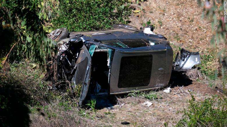 A vehicle rests on its side after a rollover accident involving golfer Tiger Woods along a road in the Rancho Palos Verdes section of Los Angeles on Tuesday.