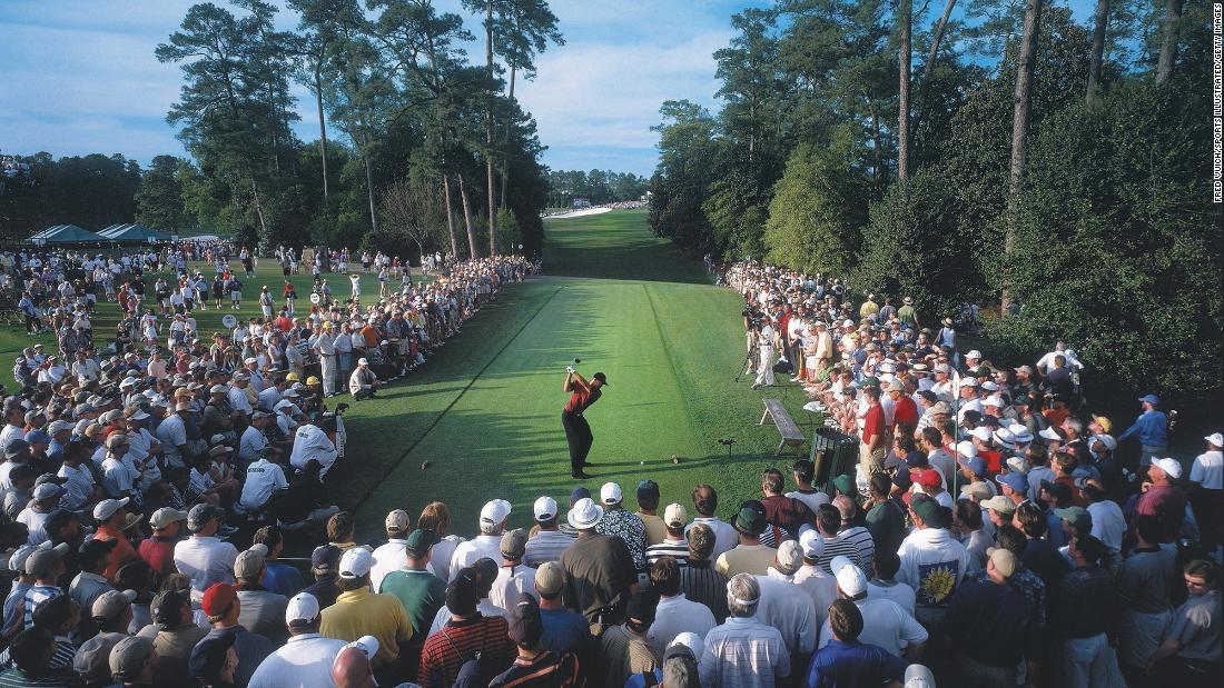 Fans watch Woods tee off on the 18th hole at the 2001 Masters. Woods went on to win the event and complete what&#39;s now called the Tiger Slam — four consecutive major titles.