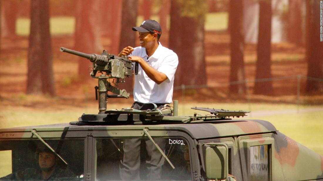 Woods arrives in a military vehicle before a golf exhibition in Fort Bragg, North Carolina, in 2004. Woods spent the week training with Army troops before hosting a junior golf clinic for his Tiger Woods Foundation. Woods&#39; father, Earl, was stationed at the base in the 1960s.