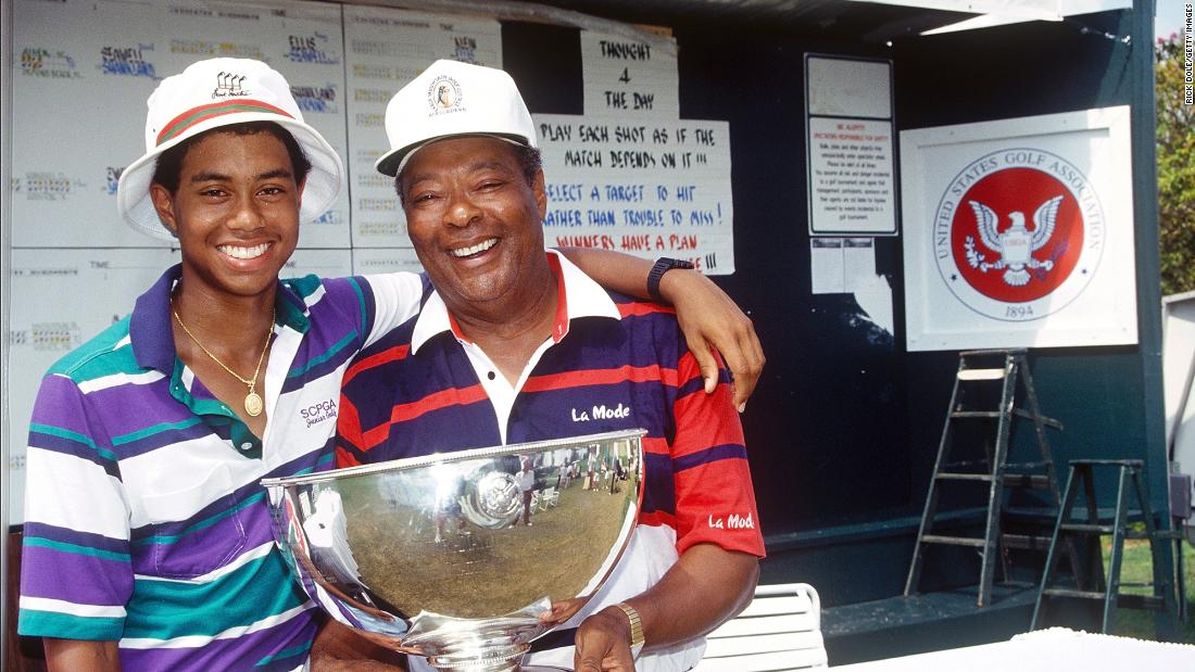 Woods and his father, Earl, celebrate after a 15-year-old Tiger won the US Junior Amateur Championship in 1991. He won the event in 1992 and 1993 as well.