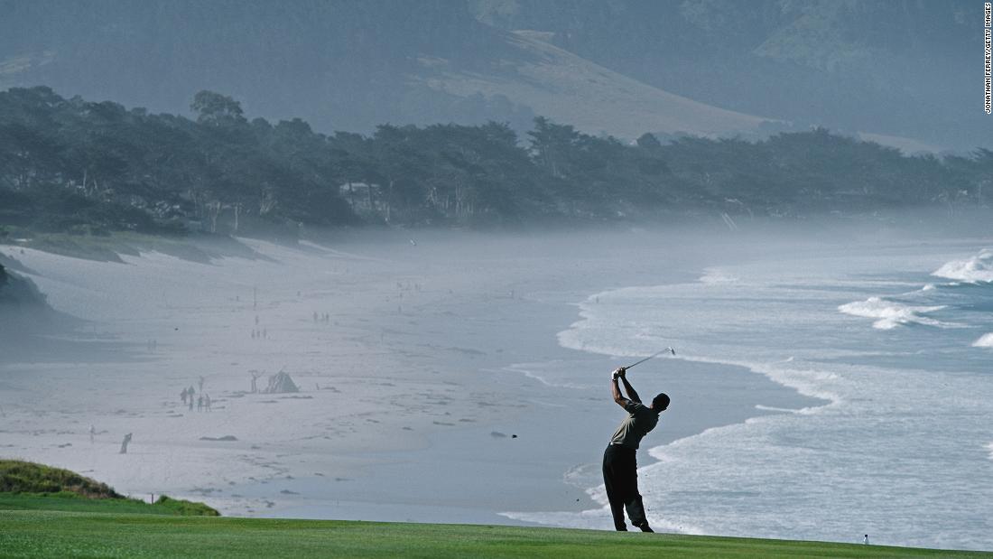 Woods plays a shot from the ninth fairway during the 2000 US Open in Pebble Beach, California. Woods won the tournament by 15 shots, a record for any major. It was Woods&#39; third major title by this point; he had also won the 1999 PGA Championship.