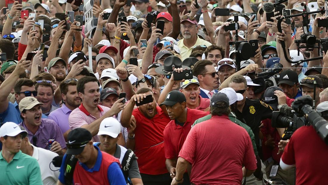 Woods is trailed by jubilant fans during the final round of the Tour Championship in Atlanta in 2018. It was &lt;a href=&quot;https://edition.cnn.com/2018/09/23/golf/tiger-woods-tour-championship-spt-intl/index.html&quot; target=&quot;_blank&quot;&gt;his first PGA Tour victory since 2013.&lt;/a&gt;