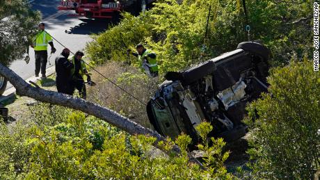 A vehicle lies on its side after a rollover accident involving golfer Tiger Woods on Tuesday.